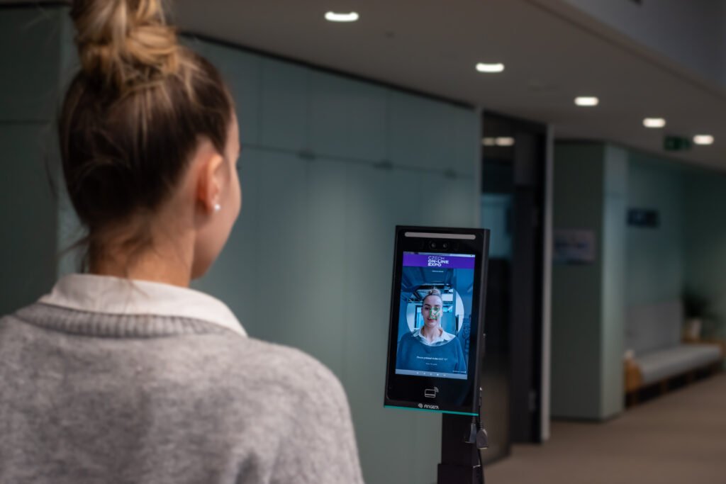 Woman using face check-in at Czech Online Expo